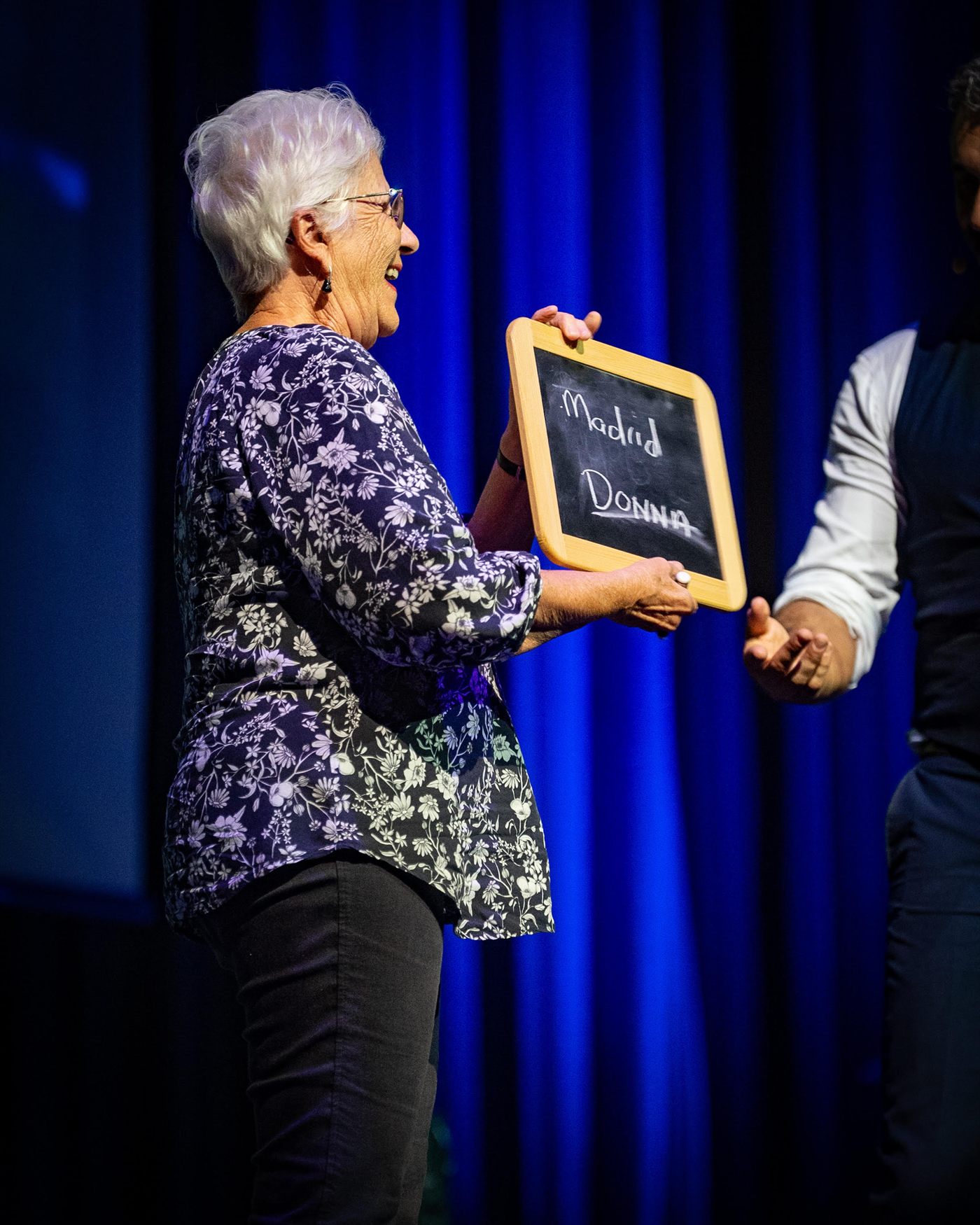 A guest reveals the impossible prediction written on a chalkboard